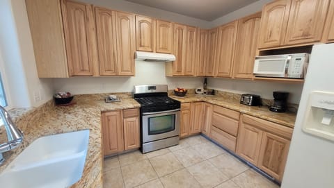 Full Kitchen with Granite Countertops. Gas Stove top and Oven.