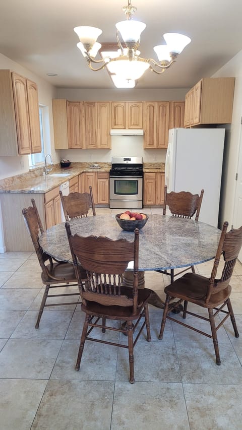 Large Dining Table. Extra Chairs Available.