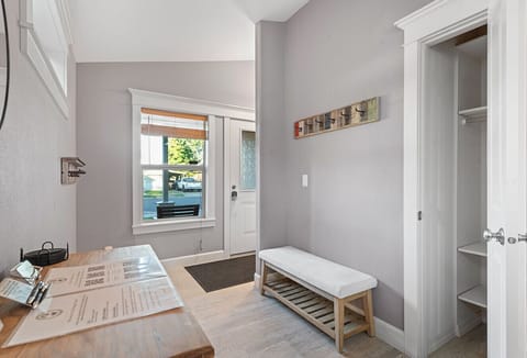 Entrance to the home with a space for taking off shoes and hanging coats