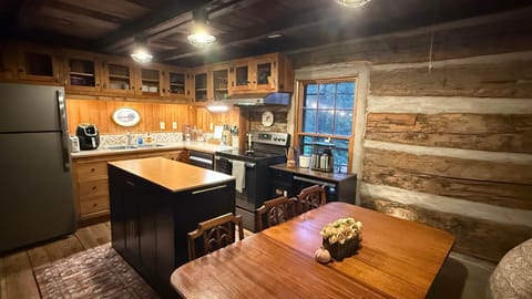 The kitchen and dining area complete with coffee station, microwave, air fryer, and range.