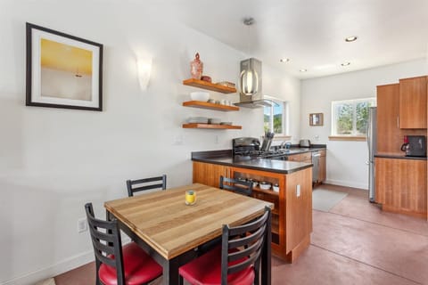 Dining and kitchen area with extendable table.

