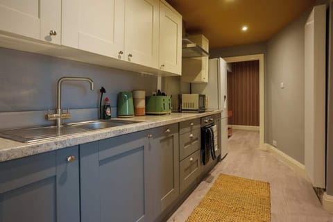 A full kitchen includes all the essential appliances and fixtures needed for cooking, preparing, and storing food.