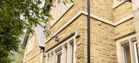 This charming exterior showcases the inviting entrance and well-maintained surroundings of the property. Featuring modern architecture blended with timeless design.