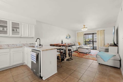 View of kitchen, dining area and living room from the entryway