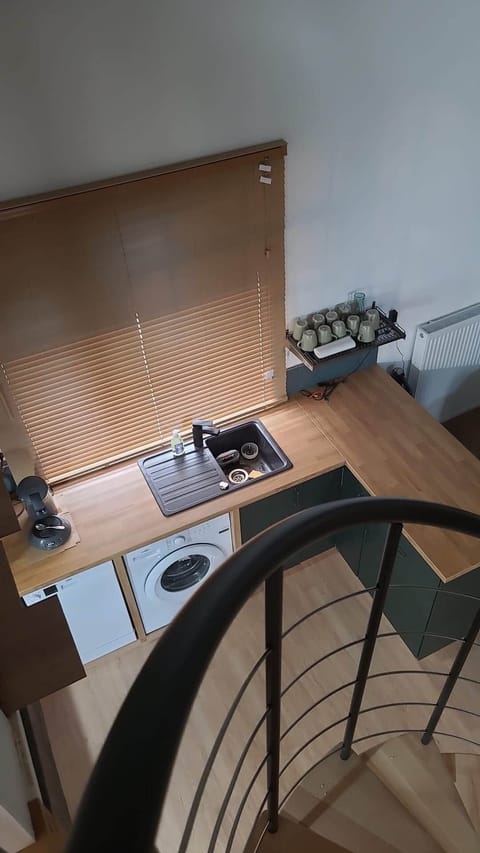 Overhead view from mezzanine of kitchen and staircase. jpg