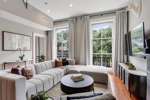  Living Room Unit 2 | Sitting Area with Fireplace and Natural Light | Unit 2 — Second Floor of Building — Unit on One Level