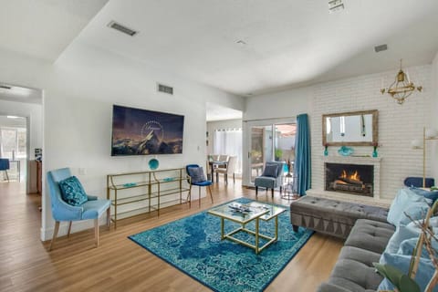 ather in the open concept living room, complete with comfortable couches, a gas fireplace, Smart TV, and sofa sleeper.