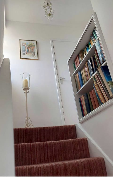 A bright stairway lined with stories