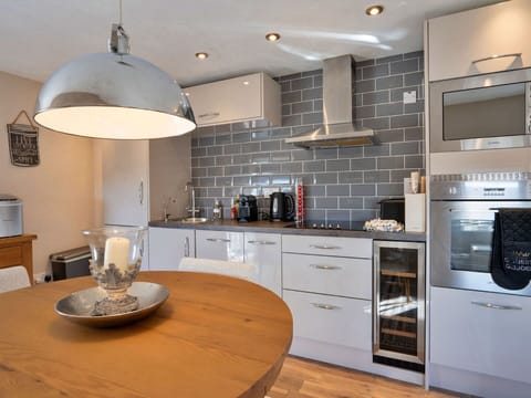 Kitchen, Interior Design, Wall, Furniture, Countertop, Flooring, Kitchen Appliance, Cabinetry, Light Fixture, Ceiling