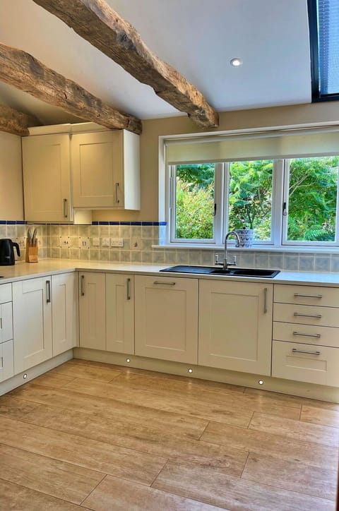 Flooring, Countertop, Interior Design, Kitchen, Furniture, Floor, Wood, Kitchen Appliance, Cabinetry, Ceiling