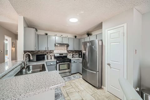 Whip up a delicious meal or enjoy a quick snack in this stylish, functional space.