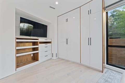 Modern bedroom with minimalist design and high-quality bedding.