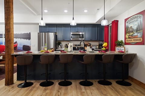Fully stocked kitchen with stainless steel appliances