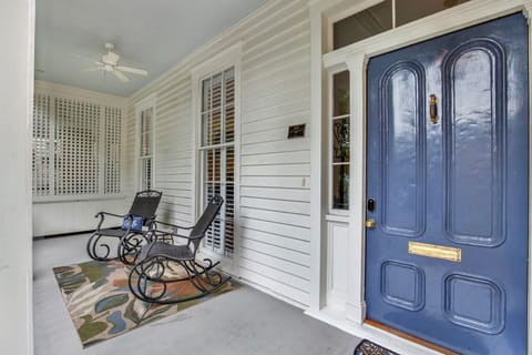 Cozy front patio with two chairs—perfect for morning coffee or evening chats.