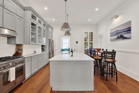 Gourmet kitchen with high-end appliances + custom cabinetry.