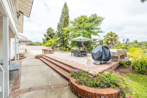 The spacious backyard features a charming brick patio with ample seating for dining al fresco or enjoying a morning coffee.