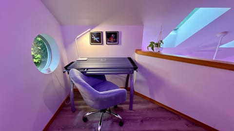 Stay productive at the dedicated workspace with fast Wi-Fi, natural light, and a unique round window