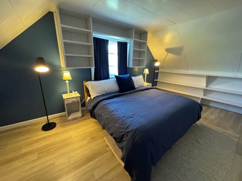 Your peaceful second-floor King bedroom with charming built-ins.Relax & Recharge