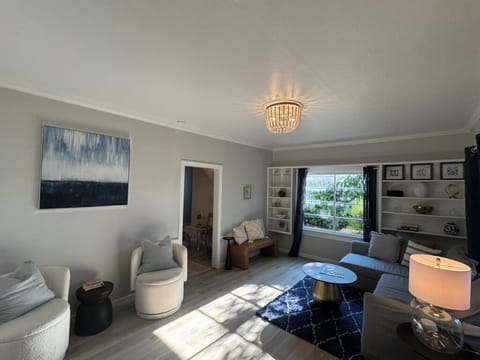 Your inviting living room with comfortable seating, Smart TV, games & a sofa bed