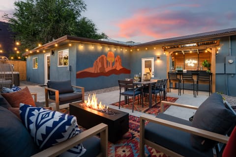 Your perfect outdoor escape awaits! Gather with loved ones by the fire pit, dine under string lights, or sip drinks at the bar, all surrounded by Southwestern charm and a stunning mural.