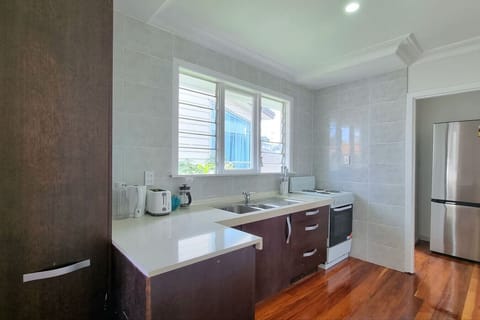 The sliding cupboard is a useful addition to the kitchen offering more storage space.