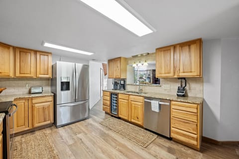 Spacious-feeling kitchen with plenty of prep space and a great view of the TV—ideal for entertaining or family nights in.