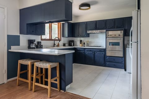 Fully equipped kitchen stocked with cookware and essentials. Ready for everything from quick bites to full meals.