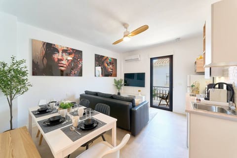 Dining and living room area with access to the terrace