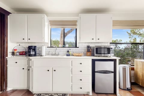 Kitchenette with a mini-fridge, microwave, and coffee maker