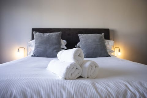 Comfy beds with fresh linens and towels provided.