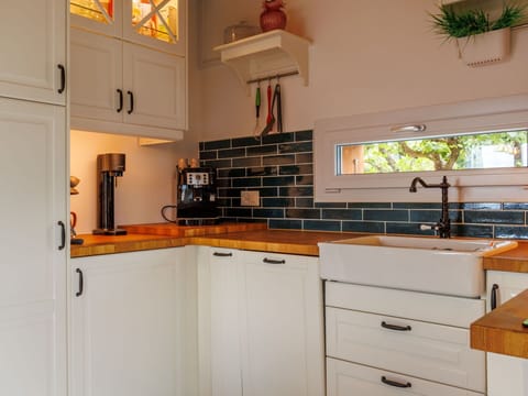 Kitchen, Countertop, Kitchen Appliance, Cabinetry, Interior Design, Wall, Wood, Major Appliance, Flooring, Furniture