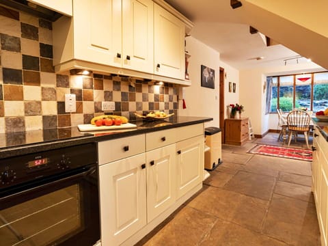 Kitchen, Kitchen Appliance, Countertop, Interior Design, Flooring, Cabinetry, Furniture, Wood, Major Appliance, Ceiling