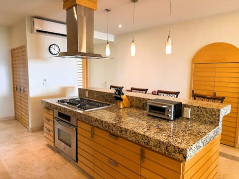 Kitchen | Central cooking station designed for convenience and culinary creativity