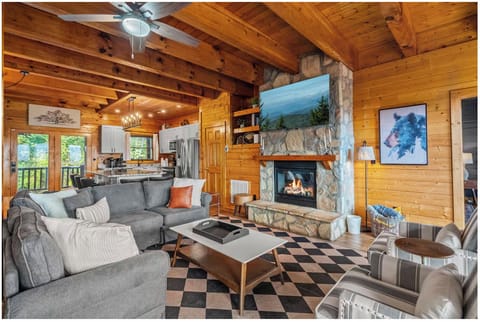 Warm up by the stone fireplace after a day in the mountains