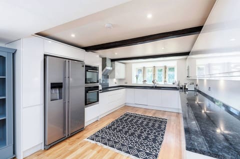 Modern appliances in the kitchen, the larder cupboard has essential condiment's