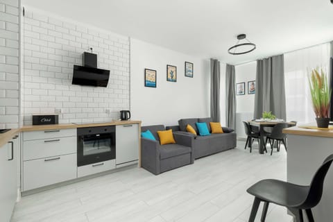 The elegant living room featuring a double sofa bed, perfect for relaxing or sleeping.