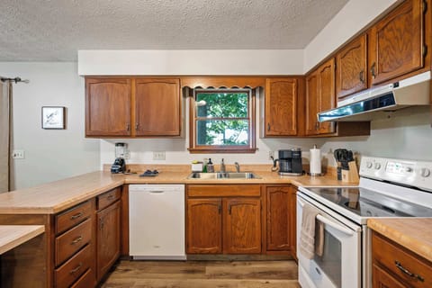 The inviting kitchen offers ample space & all the comforts of home