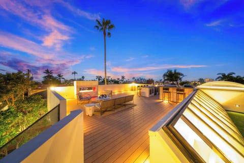 
Unwind on this stunning rooftop deck with a built-in BBQ, dining area, and plush seating. Enjoy breathtaking sunsets and starry nights from your private oasis.