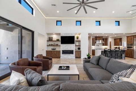 Living room with a gas fireplace and a smart TV