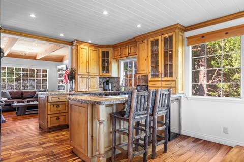 Sleek, modern kitchen with barstool seating.
