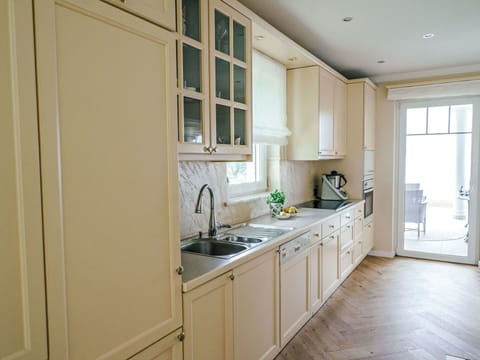 Cabinetry, Interior Design, Flooring, Countertop, Kitchen, Wood, Furniture, Floor, Kitchen Appliance, Cupboard