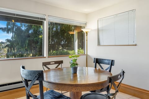 Simple table, warm light, and room for laughter located on the lower level.