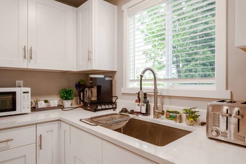 Open space with sleek countertops and modern appliances. Perfect for whipping up meals