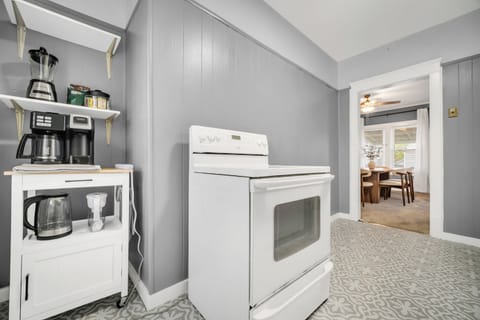 Kitchen includes a full-size oven, fridge, electric kettle, and coffee maker