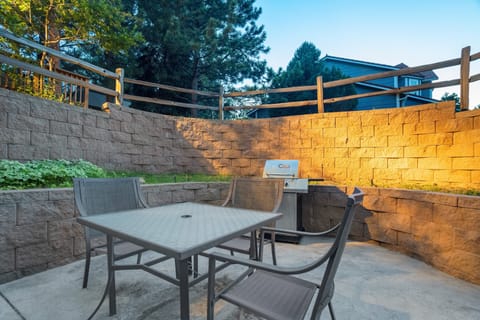 Lower deck with dining table located off the basement walkout, time to enjoy that beautiful Colorado Springs weather!