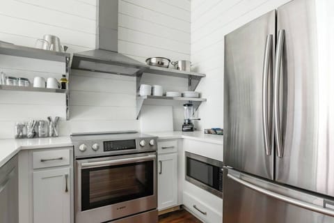 Fully equipped kitchen with modern appliances.