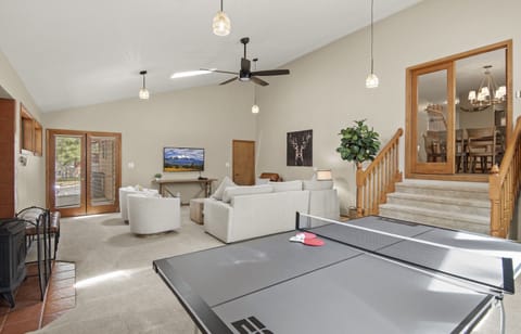 Ping pong table view of 2nd dining area. corner door leads to garage. 