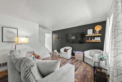 Curl up in the chic living room & stream your favorites on the smart TV​