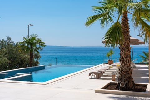 Welcome to Seaview Villa Bota – a breathtaking six-bedroom villa, idyllically located right on the beachfront of the picturesque village of Podstrana.