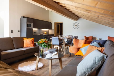 Spacious and stylish living room with modern touches and plush seating, ideal for unwinding together.